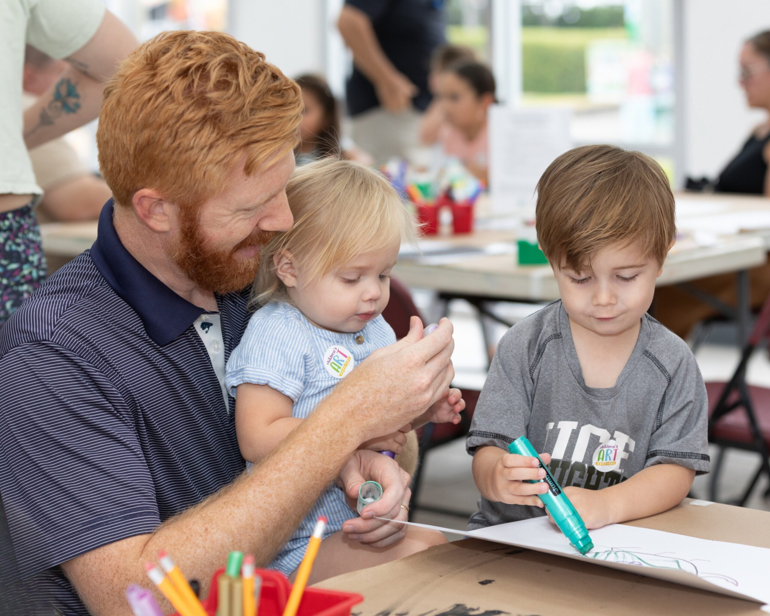 parent and children creating art in the VBMA studios